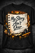Black graphic tee with the "My Story Ain't Over" design n bold graffiti lettering.