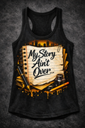 Black racerback tank featuring the "My Story Ain't Over" graphic in orange and white.
